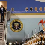 Trump Lands In China—See Photos As He Prepares For Meeting With Xi