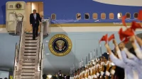 Trump Lands In China—See Photos As He Prepares For Meeting With Xi