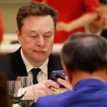 Elon Musk Takes Selfie With Rival Chinese EV Billionaire Lei Jun